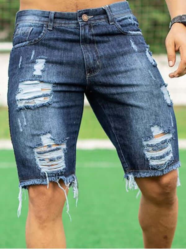 Stylish man wearing Averra slim fit ripped denim shorts, perfect for streetwear fashion and casual outings.